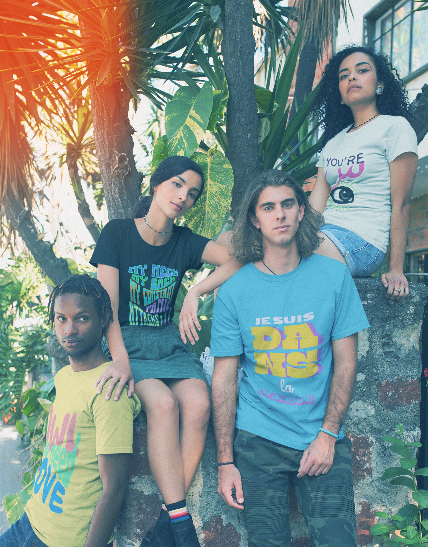 interracial-group-of-friends-wearing-t-shirts-mockup-near-plants